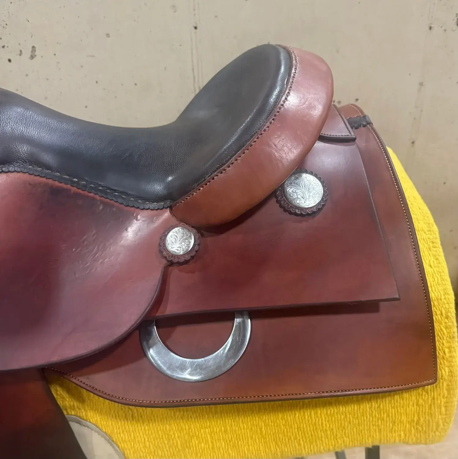 Mandy McCutcheon Reiner — cantle and silver concho close-up